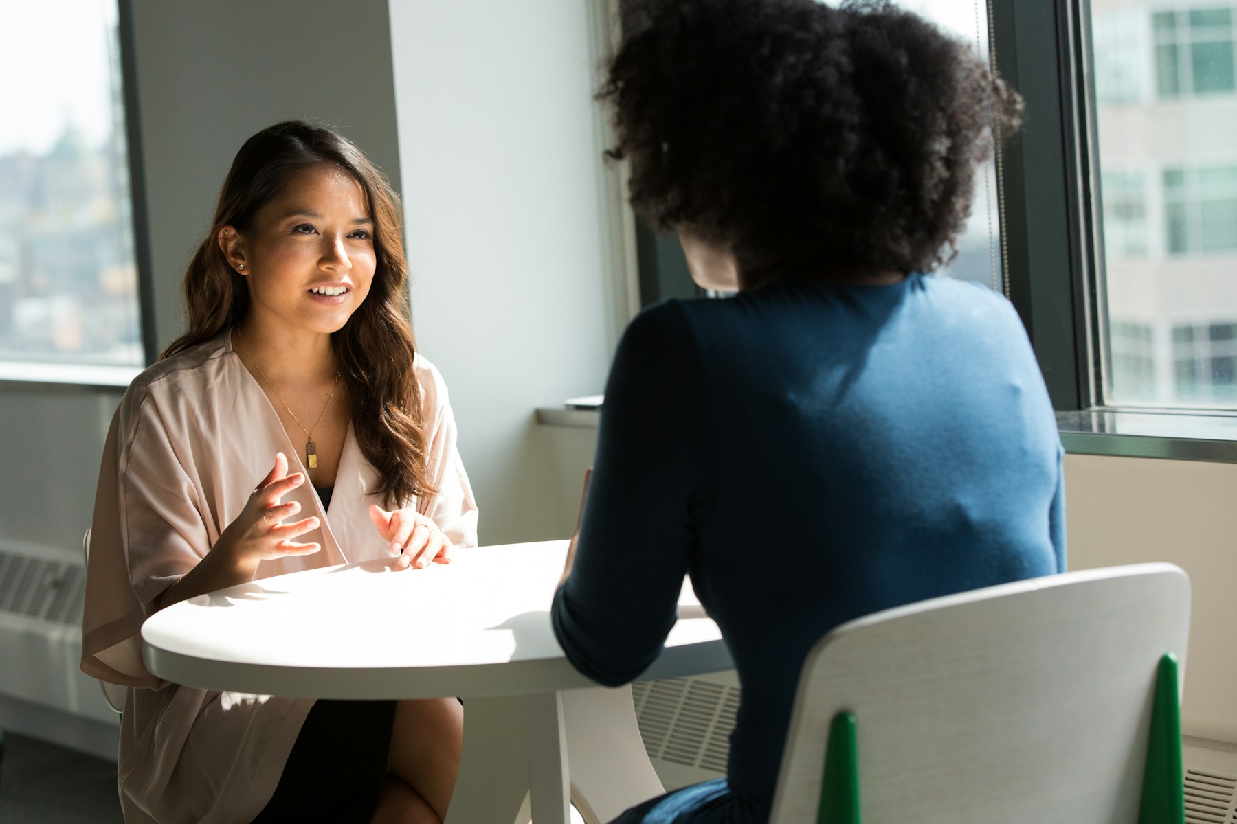 Candidate interview conversation across a table